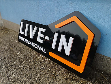 Plastic logo on black plexiglass